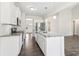 Bright kitchen features granite countertops, stainless appliances and modern cabinets at 814 Harmony Rd, Temple, GA 30179