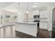 Modern kitchen boasts stainless appliances, granite countertops and open floor plan at 814 Harmony Rd, Temple, GA 30179
