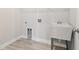 Bright laundry room with utility sink and tile flooring at 814 Harmony Rd, Temple, GA 30179