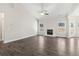 Spacious living room features wood-look floors, a fireplace, vaulted ceilings, and natural light at 814 Harmony Rd, Temple, GA 30179