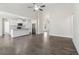 Bright open-concept living room and kitchen, featuring wood-look floors and stainless steel appliances at 814 Harmony Rd, Temple, GA 30179