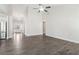 Bright, open living space with wood-look floors, leading to the entryway and other rooms at 814 Harmony Rd, Temple, GA 30179