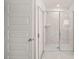 Modern bathroom featuring a glass-enclosed shower with a sleek design at 1059 Blue Juniper Cir, Loganville, GA 30052