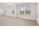 Bright bedroom with large windows offering natural light and a neutral color palette at 1059 Blue Juniper Cir, Loganville, GA 30052