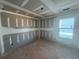 Bedroom featuring a window during construction phase, with unfinished drywall walls and ceiling at 2108 Boxwood Circle Se, Conyers, GA 30094