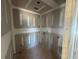 The unfinished laundry room featuring unfinished drywall, utility connections, and a doorway to another room at 2108 Boxwood Circle Se, Conyers, GA 30094