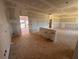 Expansive living room area with rough plumbing, unfinished walls and ceilings showcasing the home's build at 2108 Boxwood Circle Se, Conyers, GA 30094