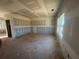 Large living room area with unfinished walls, ready for buyer to personalize and design their new living space at 2108 Boxwood Circle Se, Conyers, GA 30094