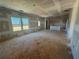 Bright living room with large windows, unfinished walls, and ceilings ready for new finishes at 2108 Boxwood Circle Se, Conyers, GA 30094