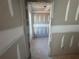 View through a doorway into an empty room of the new home shows unfinished construction of sheetrock walls and ceiling at 2108 Boxwood Circle Se, Conyers, GA 30094