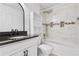 This bathroom features granite countertops, a shower-tub combo with custom tile surround, and modern fixtures at 3103 Santa Fe Pkwy, Atlanta, GA 30350