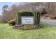 Elegant Victoria Heights community entrance sign surrounded by lush landscaping and colorful flowers at 3103 Santa Fe Pkwy, Atlanta, GA 30350