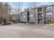 Well-maintained condominium building featuring multiple balconies and ample parking space at 3103 Santa Fe Pkwy, Atlanta, GA 30350