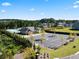 Aerial view of community clubhouse, pool, parking, and green spaces in a residential neighborhood at 4075 Near Star Ln, Cumming, GA 30028