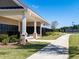 Community mailbox with sidewalk leading to tennis court on a manicured lawn at 4075 Newburn Ct, Cumming, GA 30028