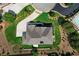 Bird's-eye view of a stunning home with a manicured lawn, pool, and spacious driveway at 805 Dempsey Ct, Marietta, GA 30064