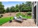 Charming brick patio with lounge chairs, offering a serene outdoor living space at 805 Dempsey Ct, Marietta, GA 30064