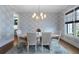 Bright dining room features statement wallpaper, chandelier, and natural light at 805 Dempsey Ct, Marietta, GA 30064