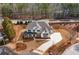 A stunning aerial view of the home with a beautifully landscaped front yard at 805 Dempsey Ct, Marietta, GA 30064