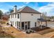 A beautiful view of the home showcasing the backyard, screened porch, and patio at 805 Dempsey Ct, Marietta, GA 30064