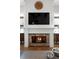 Close up of a fireplace with stone surround and decorative mantel at 805 Dempsey Ct, Marietta, GA 30064