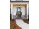 Elegant entryway features a wooden door with sidelights, framed by stone and brick accents at 805 Dempsey Ct, Marietta, GA 30064