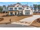 Stunning two-story home boasts beautiful stone accents and a charming front porch with white pillars at 805 Dempsey Ct, Marietta, GA 30064