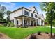 Inviting two-story home with a covered porch, manicured lawn and lovely landscaping at 805 Dempsey Ct, Marietta, GA 30064