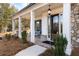 Inviting front porch features classic columns, brick accents, and a stylish entryway at 805 Dempsey Ct, Marietta, GA 30064