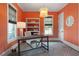 Bright home office featuring an elegant light fixture, geometric rug and built-in shelving at 805 Dempsey Ct, Marietta, GA 30064