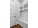 Well-organized mudroom featuring a built-in bench, coat hooks, and storage shelves for organizing essentials at 805 Dempsey Ct, Marietta, GA 30064