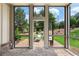 Relaxing screened porch with brick flooring, comfortable lounge seating and a view of the backyard at 805 Dempsey Ct, Marietta, GA 30064