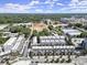 Aerial view of a vibrant community showcasing modern townhomes, lush greenery, and ongoing construction at 201 New St # 1102-8, Decatur, GA 30030