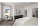 Bright, modern bedroom with large window, comfortable seating and views of the neighborhood at 201 New St # 1102-8, Decatur, GA 30030