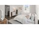 Bright bedroom with a cozy bed, motivational art, and natural light, showcasing a comfortable and inviting space at 201 New St # 1102-8, Decatur, GA 30030