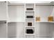 Spacious walk-in closet with custom shelving for optimal storage at 201 New St # 1102-8, Decatur, GA 30030
