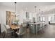 Contemporary kitchen featuring a dining area with modern chandelier and a large island with seating at 201 New St # 1102-8, Decatur, GA 30030