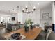 An open-concept kitchen and dining area, showcasing modern design and a large island with seating at 201 New St # 1102-8, Decatur, GA 30030