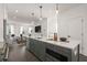 Modern kitchen featuring stainless steel appliances, white countertops and gray cabinets with an open concept view at 201 New St # 1102-8, Decatur, GA 30030