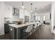 Modern kitchen featuring white cabinets, stainless steel appliances, and a large island with seating at 201 New St # 1102-8, Decatur, GA 30030