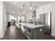 A modern kitchen featuring white cabinets, stainless steel appliances, and a large island with seating at 201 New St # 1102-8, Decatur, GA 30030
