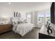 Serene main bedroom with ample natural light and stylish furnishings. Dark floors at 201 New St # 1102-8, Decatur, GA 30030