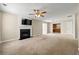 Spacious living room with fireplace feature wall, neutral walls, and an open concept flow at 2248 Asquith Sw Ave, Marietta, GA 30008