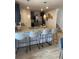 Open kitchen with granite countertops, stainless steel appliances, and bar stool seating at 746 Great Oak Pl, Villa Rica, GA 30180
