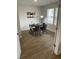 Cozy home office with wood-look floors, a sleek black desk, and natural light at 746 Great Oak Pl, Villa Rica, GA 30180