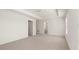 Main bedroom suite with neutral carpet, tray ceiling, and ensuite bathroom at 165 Aster Avenue, Locust Grove, GA 30248