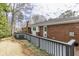 Back deck with railing overlooking a grassy yard, blending indoor/outdoor living at 18 Brandon Ridge Dr, Sandy Springs, GA 30328