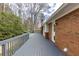 Long back deck showcasing a classic brick exterior, offering a great outdoor space at 18 Brandon Ridge Dr, Sandy Springs, GA 30328