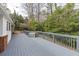 Expansive back deck with grey wood finish, offering ample space for outdoor seating at 18 Brandon Ridge Dr, Sandy Springs, GA 30328