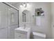 Stylish bathroom with a glass shower, white vanity, and modern fixtures at 18 Brandon Ridge Dr, Sandy Springs, GA 30328